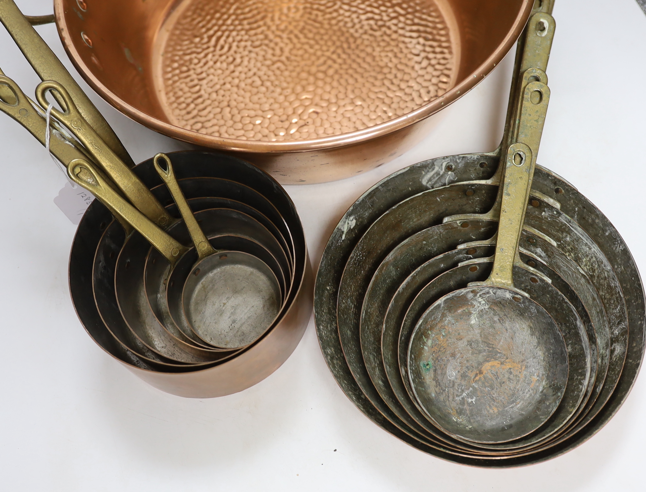 A set of 6 graduated saucepans and a similar and a 2 handled preserve pan, 45cm